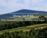 Łysica, najwyższy szczyt Gór Świętokrzyskich, wznosi się majestatycznie na tle błękitnego nieba.